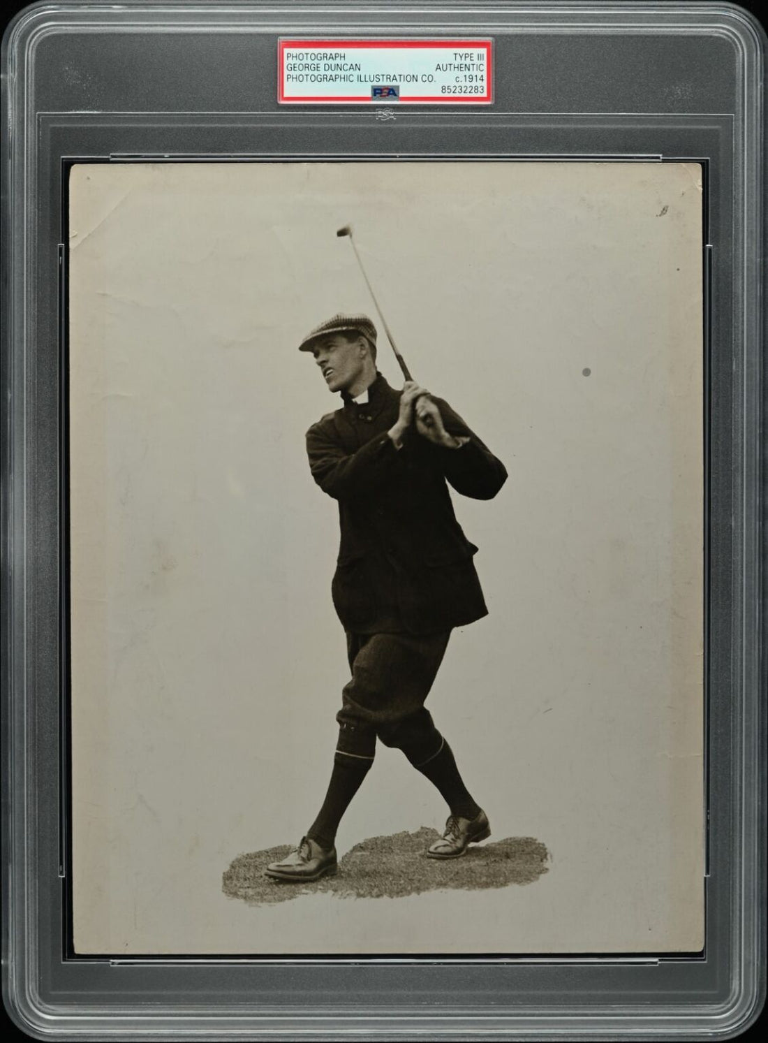 PSA authenticated c.1914 photographic illustration of golfer George Duncan captured in full follow-through swing during the early professional era of golf
