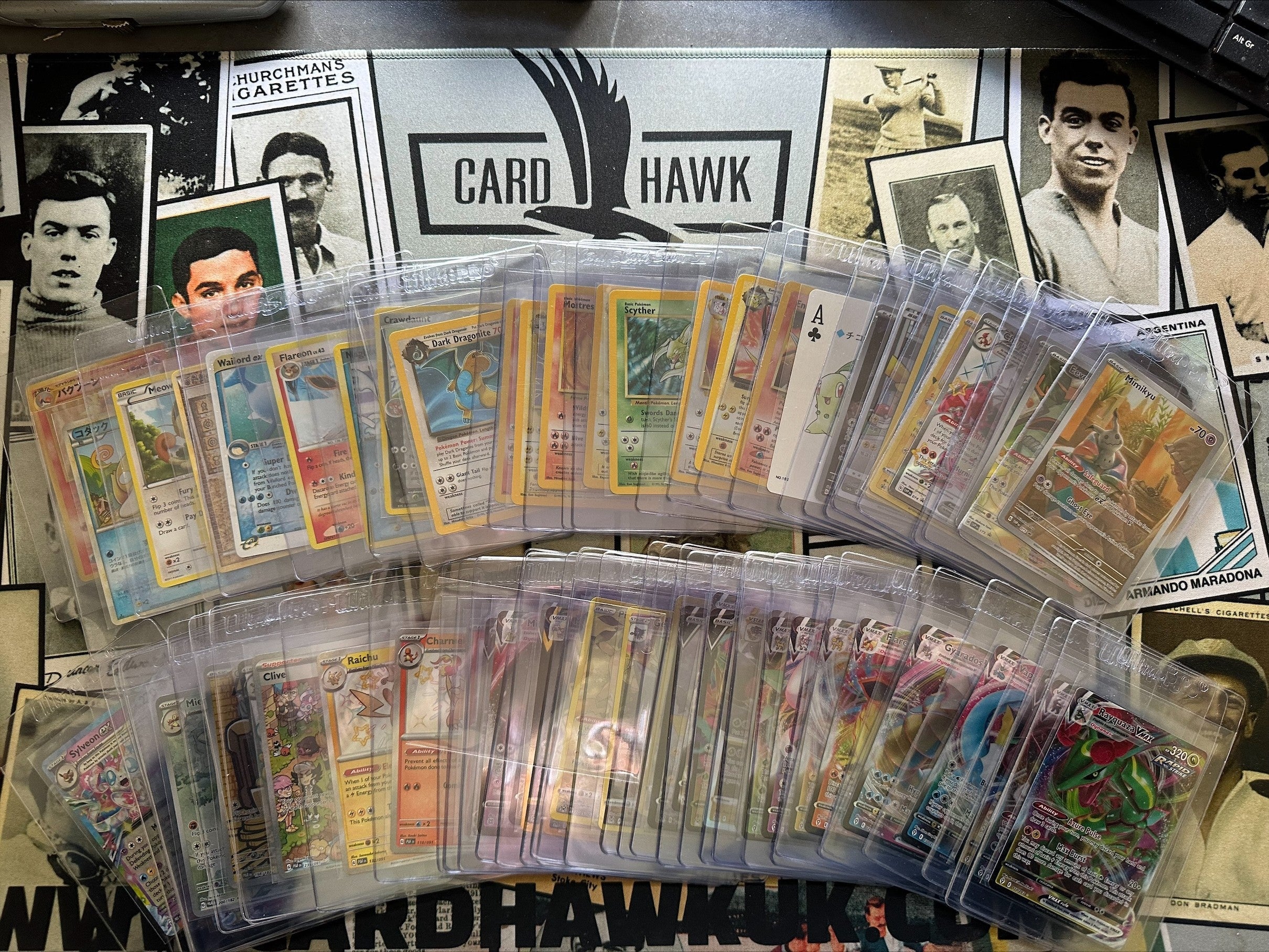 Stack of Pokémon cards ready for grading, featuring vintage and modern designs