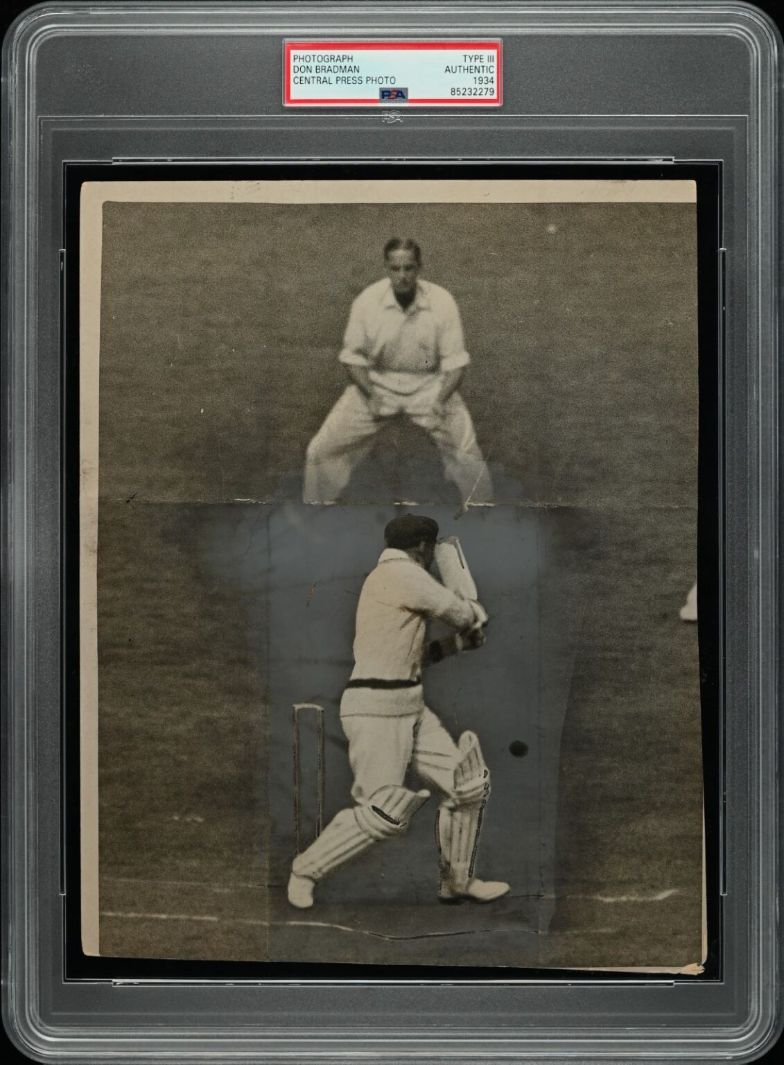 PSA encapsulated 1934 Central Press press photograph of Don Bradman batting in action at the crease during the peak of his cricketing career.